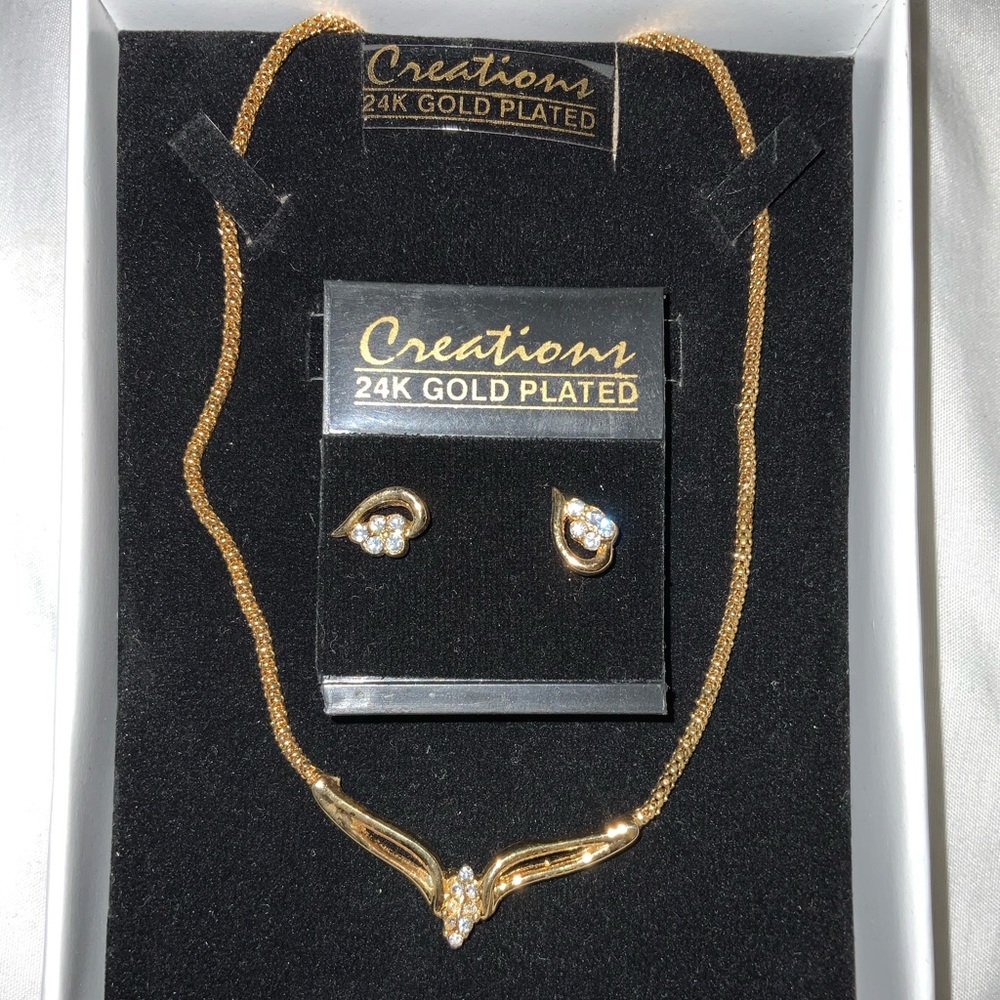 Creations, gold plated necklace with earrings.